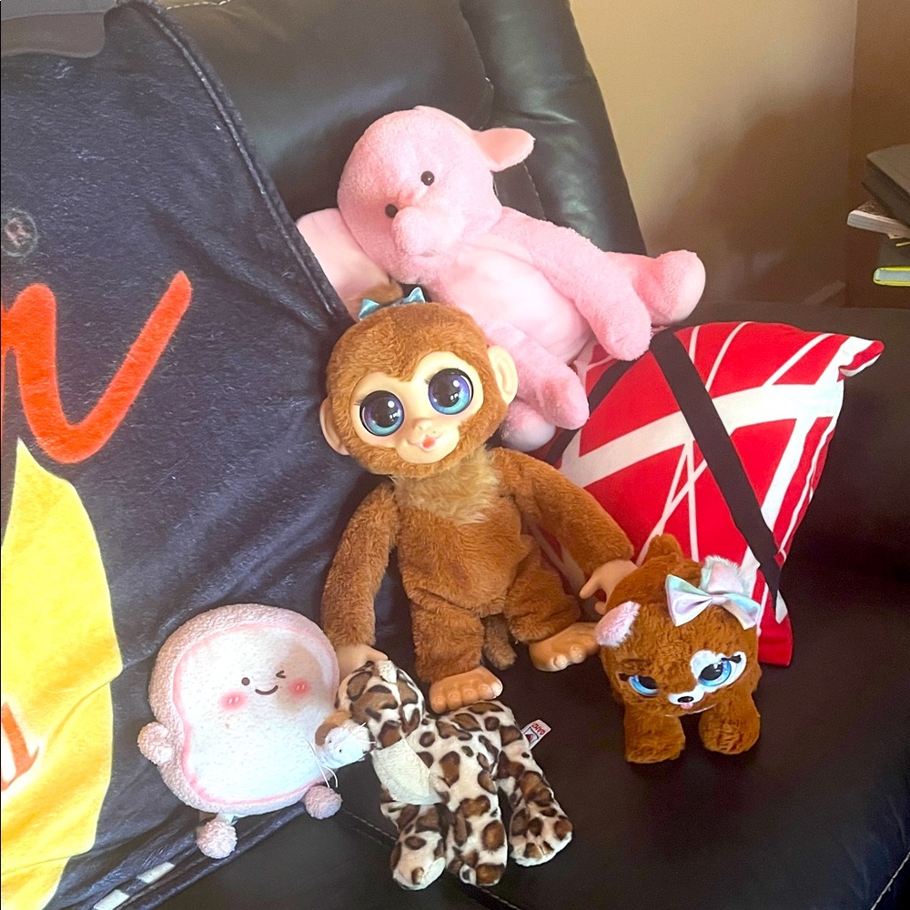 Stuffed animals two of them are mechanical. The monkey and bear.